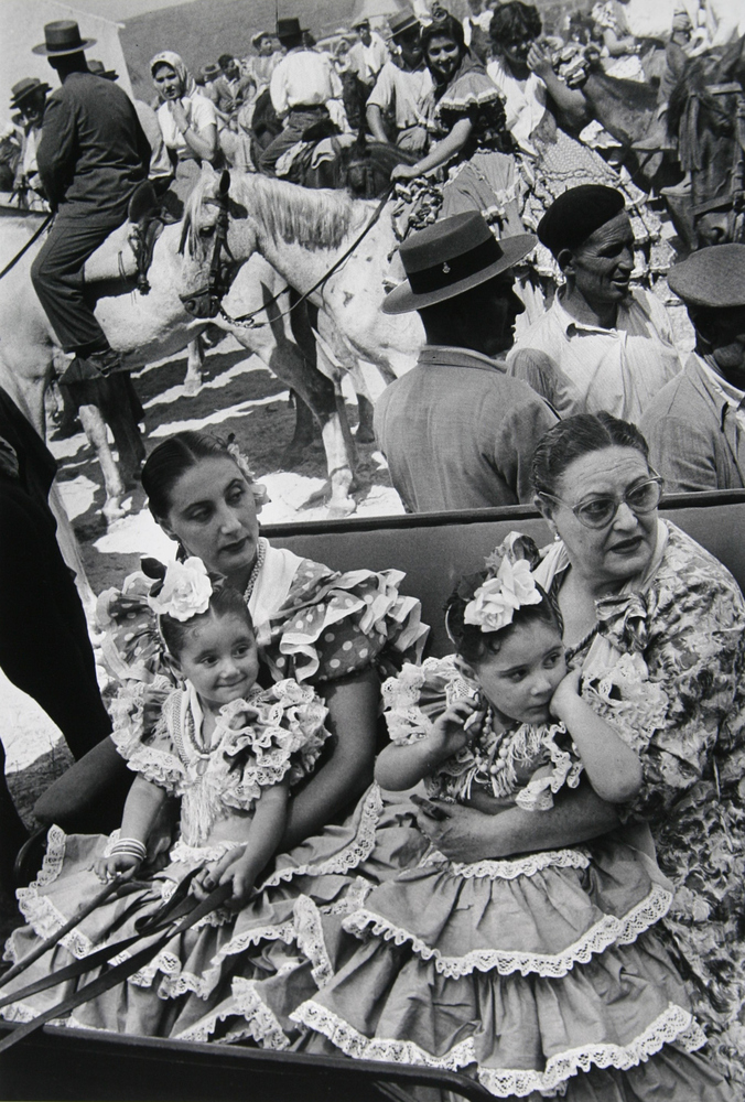 Watching departure of Rocio procession by Inge Morath